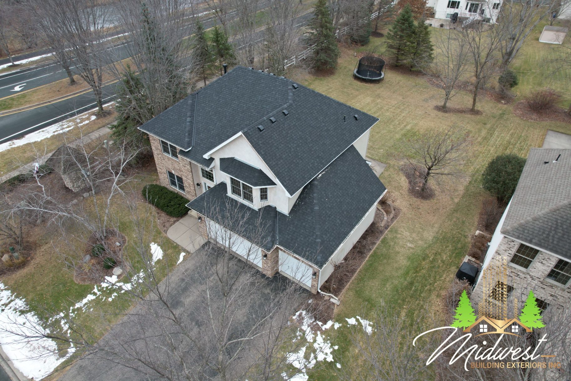 Charcoal two-story asphalt roof on stucco home — Inver Grove Heights, MN