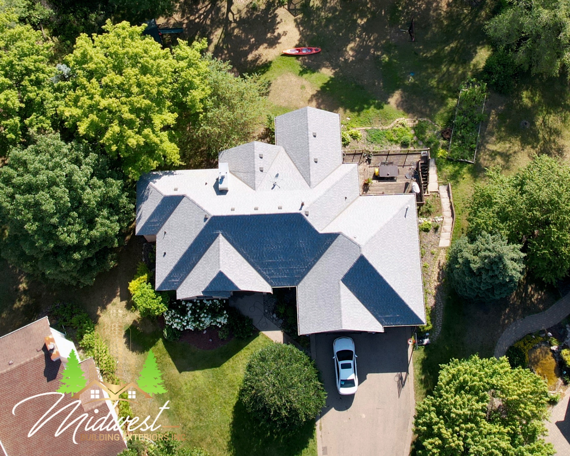 Asphalt roof replacement on wooded estate home — Eden Prairie, MN