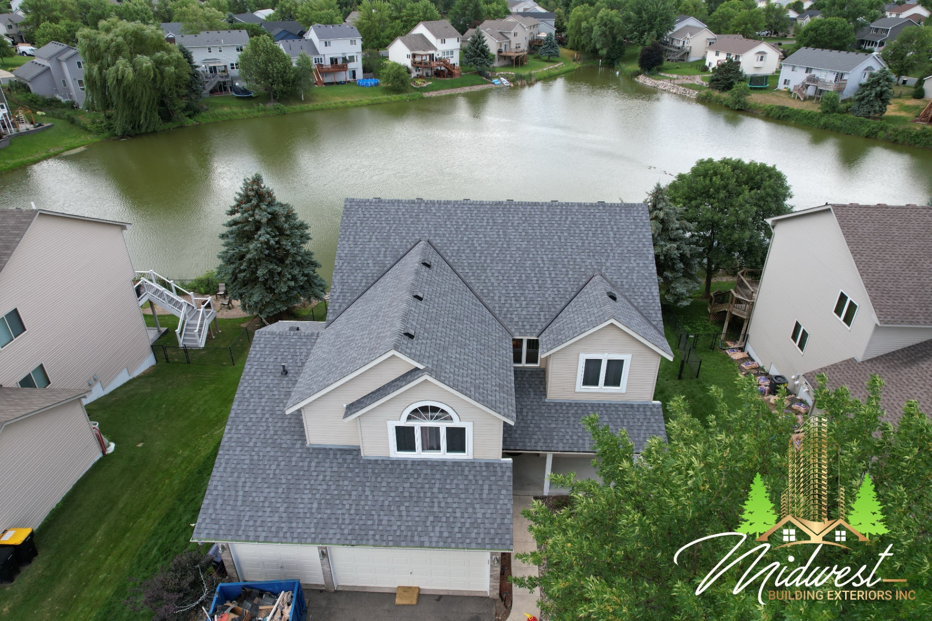 Pondside two-story asphalt roof — Apple Valley, MN