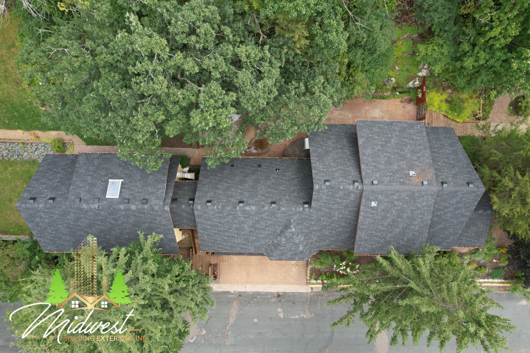 Long-ridge charcoal shingle roof — St. Croix Falls, WI
