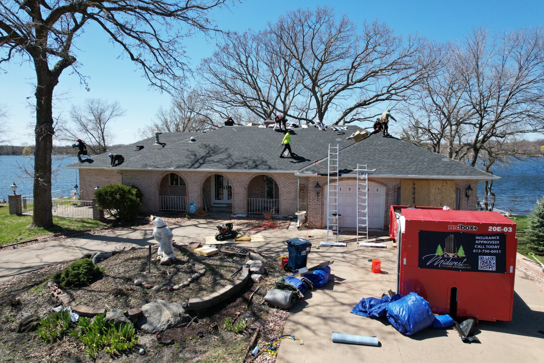 Lakefront home roof replacement with crew on site — Lake Minnetonka, MN