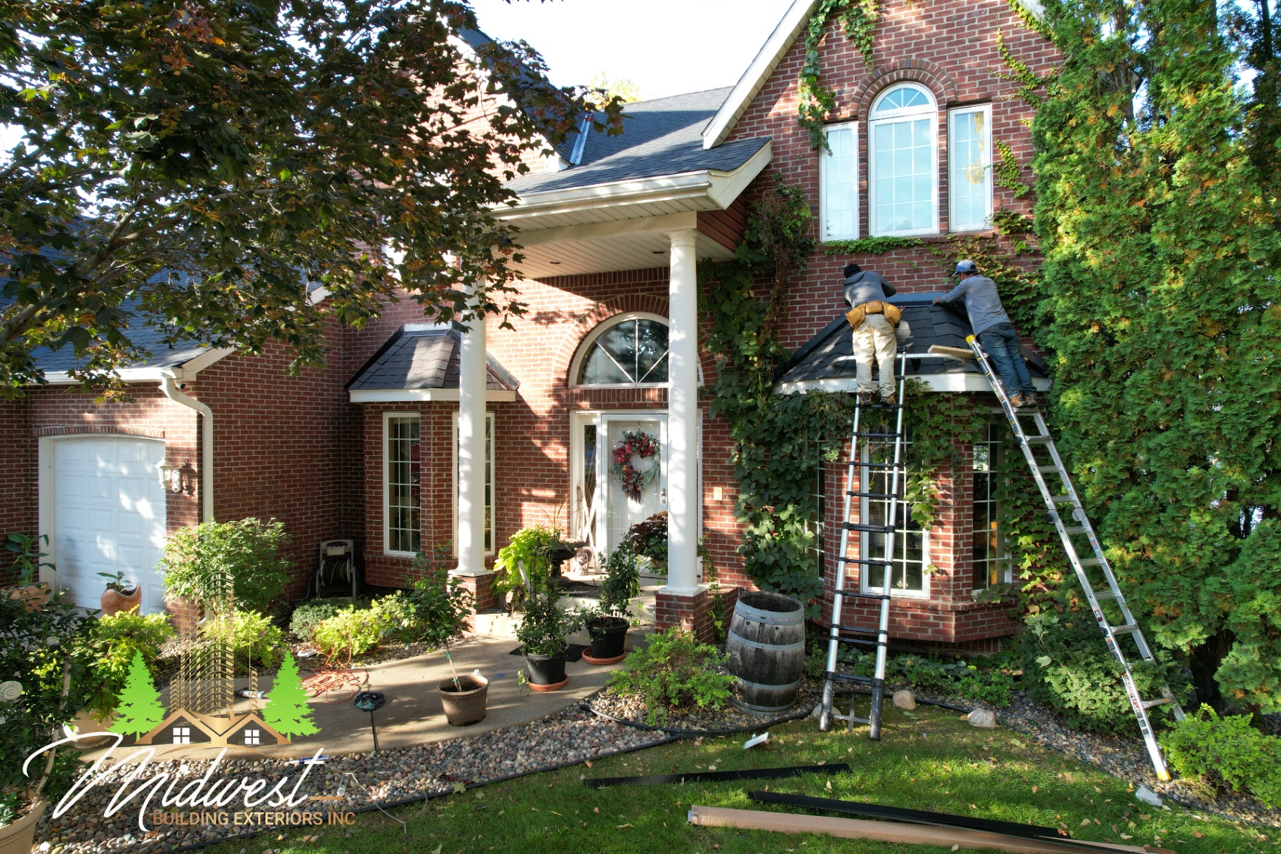 Siding & exterior repair on brick estate home with bay window and front porch — Twin Cities, MN