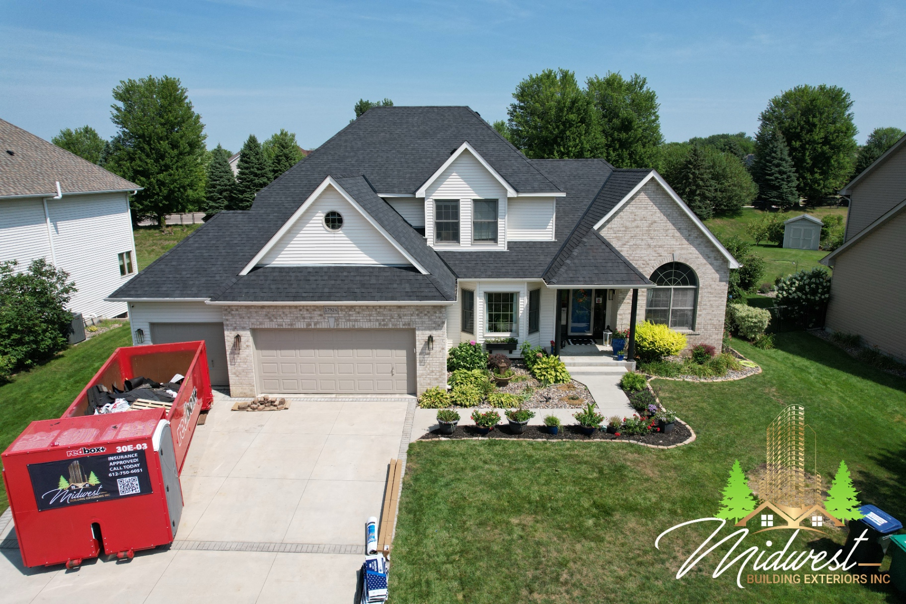 Completed siding & exterior with brick accents and MBE redbox+ dumpster staged on-site — Lakeville, MN